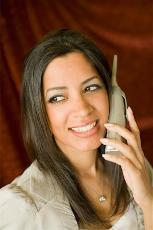 simsearch:630-01492890,k - Close-up of a young woman talking on a cordless phone Foto de stock - Royalty Free Premium, Número: 630-01877727