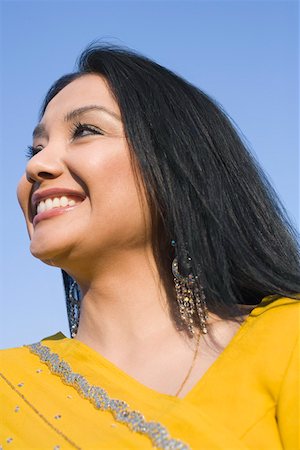 desi adults - Close-up of a young woman smiling Stock Photo - Premium Royalty-Free, Code: 630-01877796