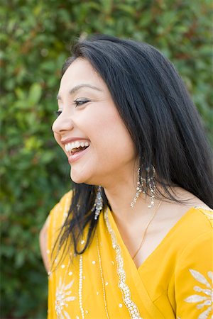 desi adults - Close-up of a young woman smiling Stock Photo - Premium Royalty-Free, Code: 630-01877793