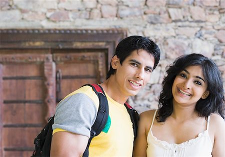 Portrait of a young couple smiling Stock Photo - Premium Royalty-Free, Code: 630-01872353
