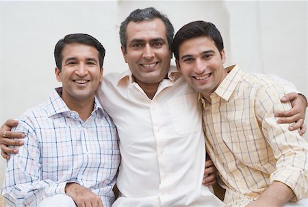 simsearch:656-01765786,k - Portrait of two mid adult men and a young man smiling Stock Photo - Premium Royalty-Free, Code: 630-01872703