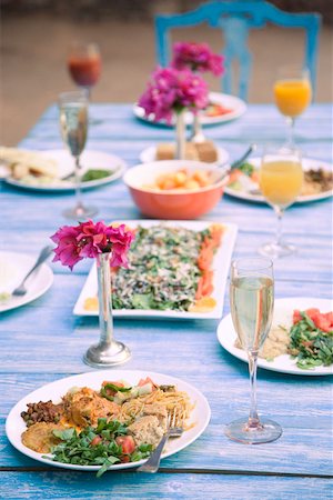 dining table plates dinner - Food served on a dining table Stock Photo - Premium Royalty-Free, Code: 630-01872809