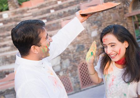 Mid adult couple celebrating holi Stock Photo - Premium Royalty-Free, Code: 630-01873022