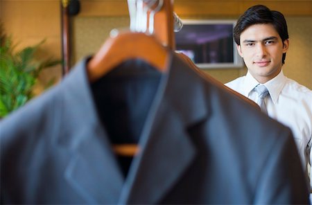 shirt on hanger - Portrait of a businessman smiling Stock Photo - Premium Royalty-Free, Code: 630-01873098