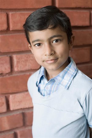 Portrait of a boy smirking Stock Photo - Premium Royalty-Free, Code: 630-01873422