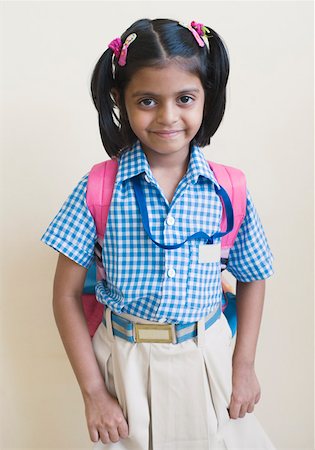 elementary school girl indian - Portrait of a schoolgirl smiling Stock Photo - Premium Royalty-Free, Code: 630-01873514