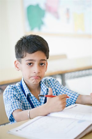 simsearch:630-01873573,k - Portrait of a schoolboy holding a pencil and smirking Stock Photo - Premium Royalty-Free, Code: 630-01873785
