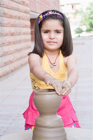 Portrait of a girl making a pottery Stock Photo - Premium Royalty-Free, Code: 630-01873834