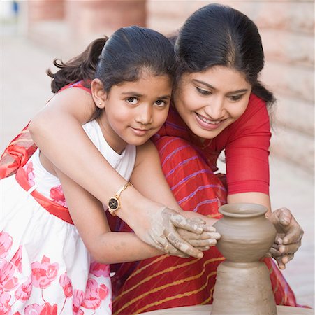 professional camera - Portrait of a girl with her teacher in a pottery class Stock Photo - Premium Royalty-Free, Code: 630-01873841