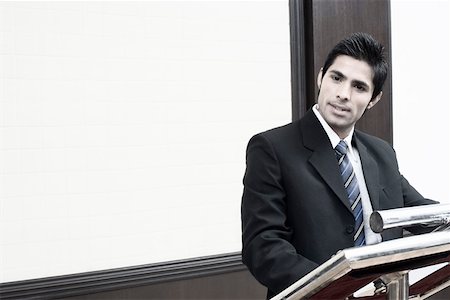 front and centre - Portrait of a businessman giving a speech Stock Photo - Premium Royalty-Free, Code: 630-01873864