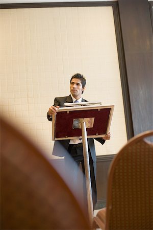 simsearch:630-01873878,k - Businessman standing at a lectern Stock Photo - Premium Royalty-Free, Code: 630-01873903