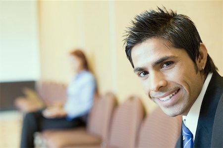 Portrait of a businessman smiling Stock Photo - Premium Royalty-Free, Code: 630-01873911