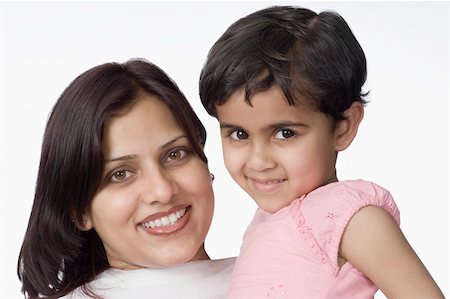 simsearch:630-02219353,k - Portrait of a mid adult woman smiling with her daughter Stock Photo - Premium Royalty-Free, Code: 630-02219394