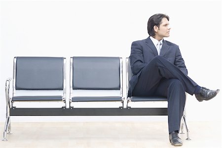 simsearch:630-02219583,k - Businessman sitting on a bench and looking away Stock Photo - Premium Royalty-Free, Code: 630-02219390