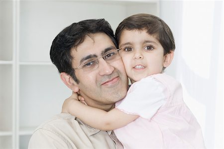 simsearch:630-02219591,k - Portrait of a girl hugging her father Stock Photo - Premium Royalty-Free, Code: 630-02219392