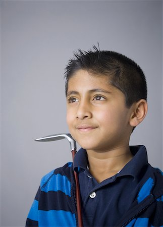 simsearch:630-02220721,k - Close-up of a boy holding a golf club and smiling Foto de stock - Sin royalties Premium, Código: 630-02219403