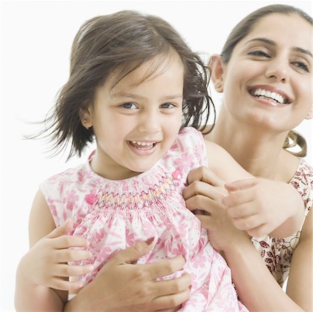 simsearch:630-02221079,k - Close-up of a girl playing with her mother and smiling Foto de stock - Sin royalties Premium, Código: 630-02219524