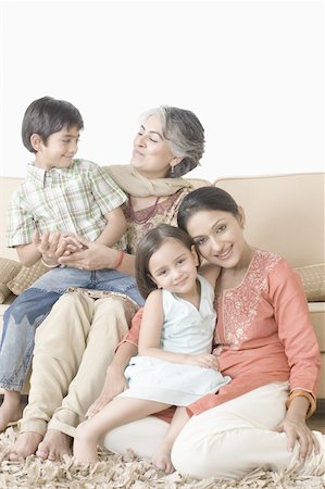 Portrait of a mid adult woman with her daughter and a mature woman with her grandson Stock Photo - Premium Royalty-Free, Code: 630-02219555