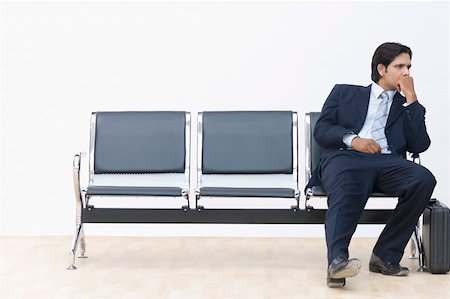 frustrated man with briefcase - Businessman sitting on a bench and looking away Stock Photo - Premium Royalty-Free, Code: 630-02219583