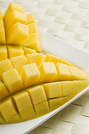 Close-up of mango slices cut into segments Stock Photo - Premium Royalty-Free, Code: 630-02219674