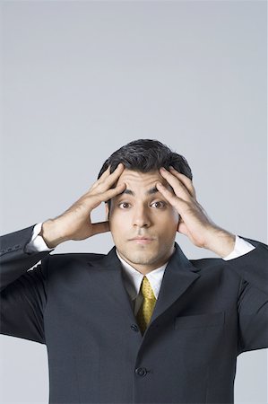 simsearch:630-02219583,k - Portrait of a businessman suffering from a headache Stock Photo - Premium Royalty-Free, Code: 630-02219700