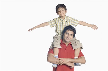 simsearch:630-02219554,k - Portrait of a young man carrying his son on his shoulders Stock Photo - Premium Royalty-Free, Code: 630-02219756