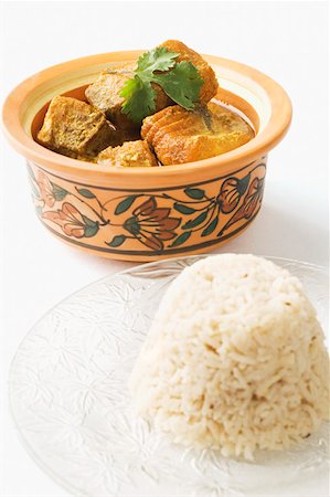 fish stew - Close-up of boiled rice served with fish curry in a bowl Stock Photo - Premium Royalty-Free, Code: 630-02219783