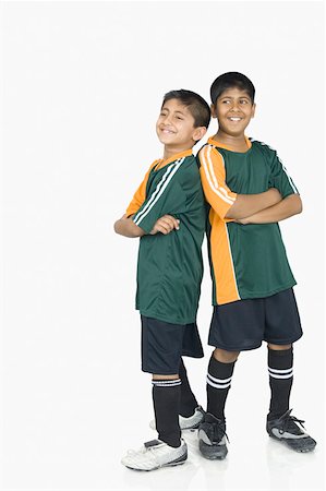 Two boys wearing sports clothing and smiling Stock Photo - Premium Royalty-Free, Code: 630-02219807