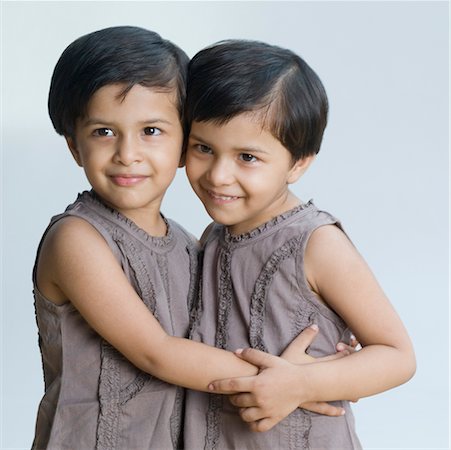 simsearch:630-02220024,k - Close-up of two girls hugging each other Stock Photo - Premium Royalty-Free, Code: 630-02219866