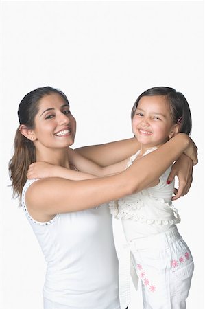 simsearch:630-02219353,k - Portrait of a girl hugging her mother and smiling Stock Photo - Premium Royalty-Free, Code: 630-02219925