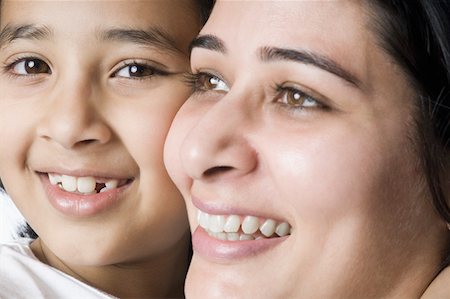 simsearch:630-02219353,k - Portrait of a girl smiling with her mother Stock Photo - Premium Royalty-Free, Code: 630-02219936