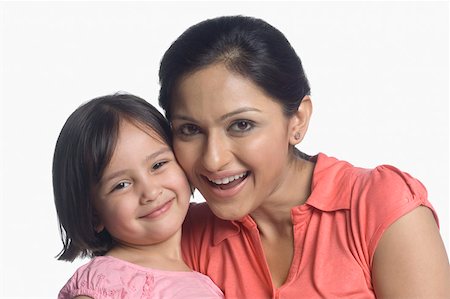 simsearch:630-02220024,k - Portrait of a mid adult woman smiling with her daughter Stock Photo - Premium Royalty-Free, Code: 630-02219946