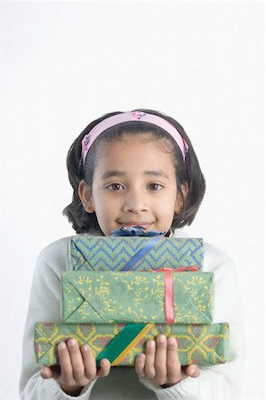 simsearch:630-02220906,k - Portrait of a girl holding presents Stock Photo - Premium Royalty-Free, Code: 630-02219965