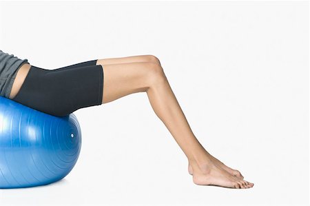 simsearch:630-02220846,k - Young woman exercising with a fitness ball Stock Photo - Premium Royalty-Free, Code: 630-02220073