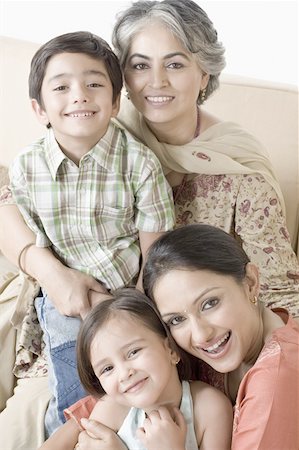 daughter feet - Portrait of a mid adult woman with her daughter and a mature woman with her grandson Stock Photo - Premium Royalty-Free, Code: 630-02220144