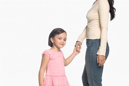 parent holding hands child silhouette - Portrait d'une jeune fille tenant la main de sa mère Photographie de stock - Premium Libres de Droits, Code: 630-02220147