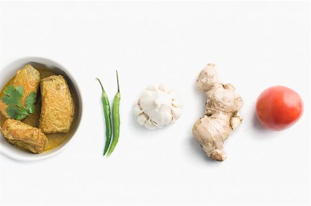 spices bowl closeup - Close-up of fish curry served in a bowl with raw vegetables Stock Photo - Premium Royalty-Free, Code: 630-02220173