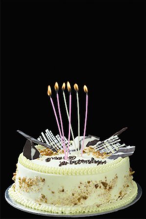 Close-up of lit candles on a birthday cake Stock Photo - Premium Royalty-Free, Code: 630-02220300