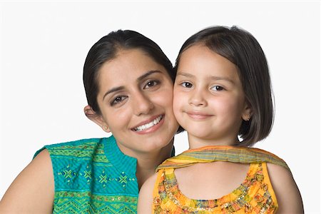 simsearch:630-02221079,k - Portrait of a young woman cheek to cheek with her daughter and smiling Foto de stock - Sin royalties Premium, Código: 630-02220310