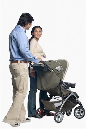 stroller - Side profile of a couple holding a baby stroller Stock Photo - Premium Royalty-Free, Code: 630-02220345