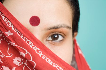 Close-up of a young woman's face covered with a stole Stock Photo - Premium Royalty-Free, Code: 630-02220366