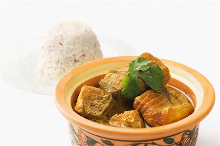 Close-up of fish curry in a bowl served with boiled rice Stock Photo - Premium Royalty-Free, Code: 630-02220363