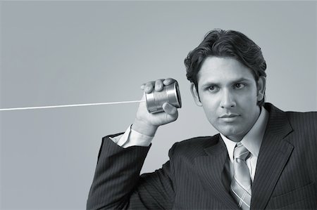 simsearch:630-02219583,k - Businessman listening with a tin can and a string Stock Photo - Premium Royalty-Free, Code: 630-02220373