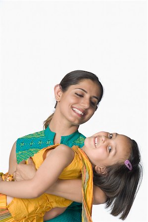 simsearch:630-02220024,k - Young woman carrying her daughter Stock Photo - Premium Royalty-Free, Code: 630-02220507
