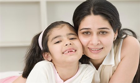simsearch:630-02219353,k - Portrait of a girl smiling with her mother Stock Photo - Premium Royalty-Free, Code: 630-02220529