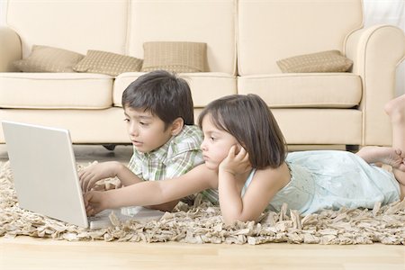 simsearch:630-02220024,k - Boy and girl using a laptop Stock Photo - Premium Royalty-Free, Code: 630-02220547