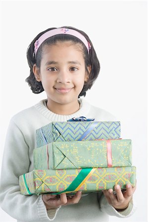 simsearch:630-02220906,k - Portrait of a girl holding presents Stock Photo - Premium Royalty-Free, Code: 630-02220565