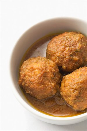 Close-up of meatballs served in a bowl Fotografie stock - Premium Royalty-Free, Codice: 630-02220573