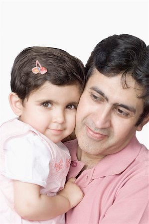 simsearch:630-02219591,k - Close-up of a mid adult man carrying his daughter and smiling Stock Photo - Premium Royalty-Free, Code: 630-02220584