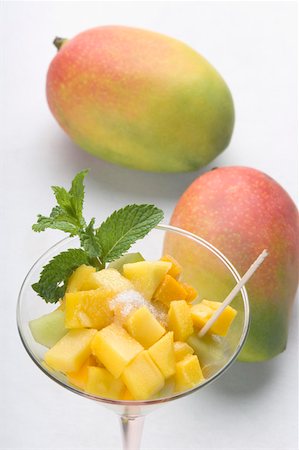 salads and desserts - Close-up of a glass of mango slices and melon slices with mangoes Stock Photo - Premium Royalty-Free, Code: 630-02220643